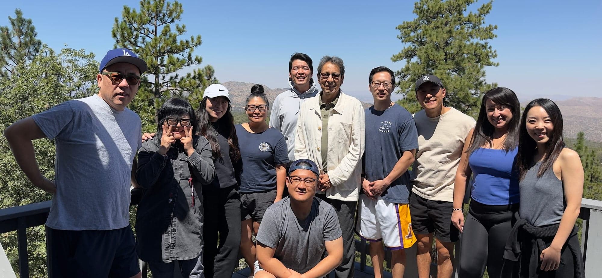 Mentor For Change board members and supporters gathered on a mountain overlook