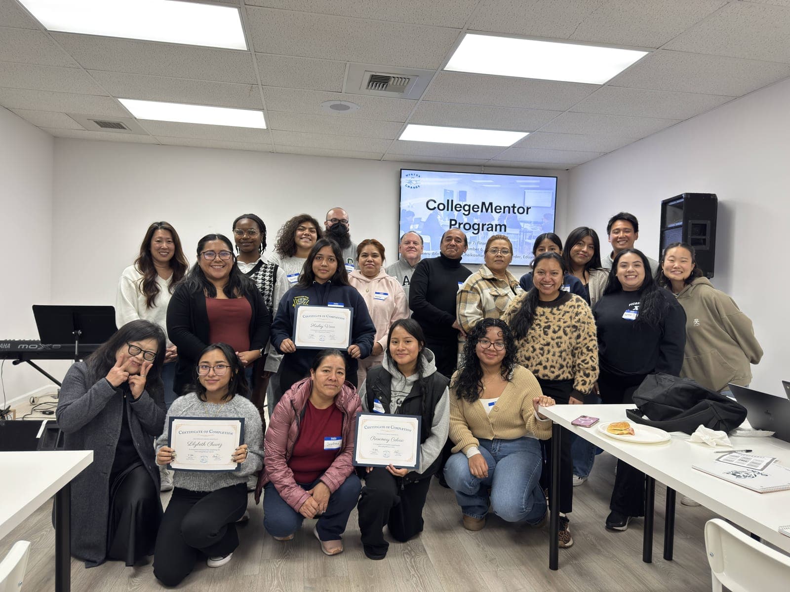 CollegeMentor participants holding certificates at a workshop